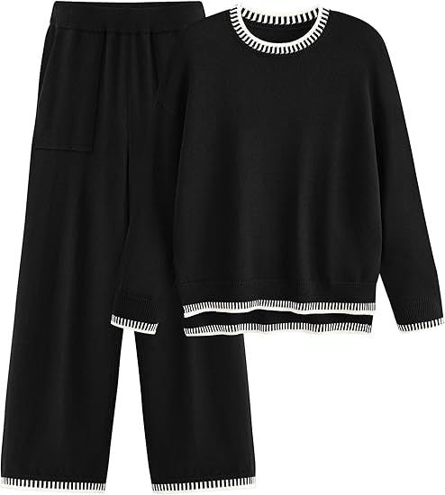 Set coordinato donna nero, maglione e pantaloni larghi, dettagli a righe bianche, moda autunno inverno, abbigliamento casual elegante.