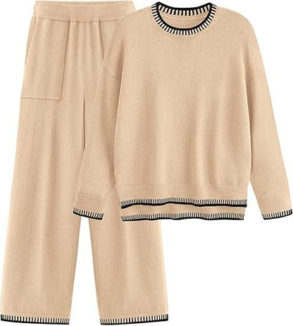 Completo loungewear donna beige, maglione e pantaloni larghi, dettagli a righe nere, tessuto morbido, abbigliamento casual e confortevole.