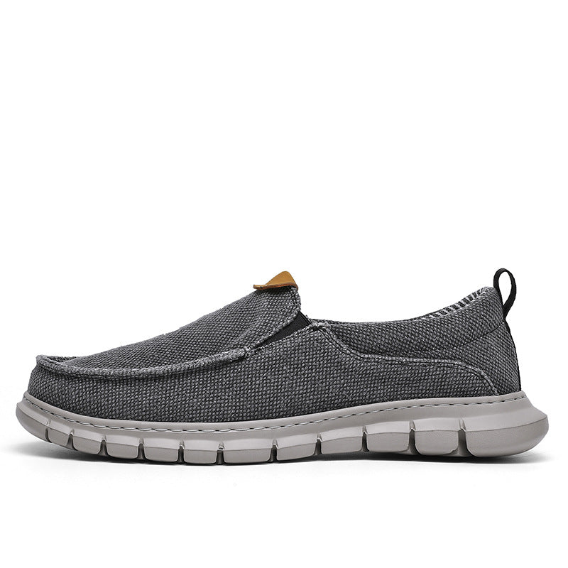 Scarpa casual grigia da uomo, tessuto traspirante, suola in gomma antiscivolo, design slip-on, ideale per passeggiate e tempo libero.