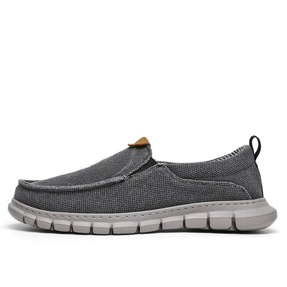 Scarpa casual grigia da uomo, tessuto traspirante, suola in gomma antiscivolo, design slip-on, ideale per passeggiate e tempo libero.