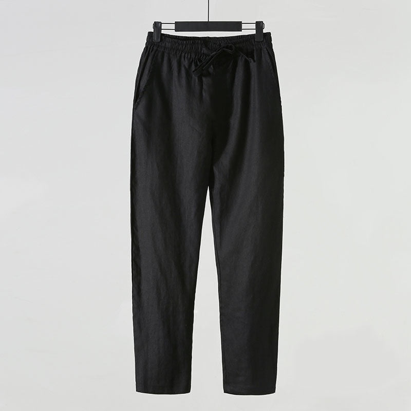 Pantaloni neri in lino, eleganti e casual, con elastico in vita e tasche laterali. Ideali per moda uomo, abbigliamento estivo, comfort quotidiano.