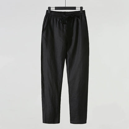 Pantaloni neri in lino, eleganti e casual, con elastico in vita e tasche laterali. Ideali per moda uomo, abbigliamento estivo, comfort quotidiano.