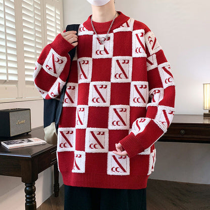 Maglione rosso a quadri bianchi con motivo geometrico, indossato da una persona in una stanza moderna. Design alla moda, stile casual autunnale.