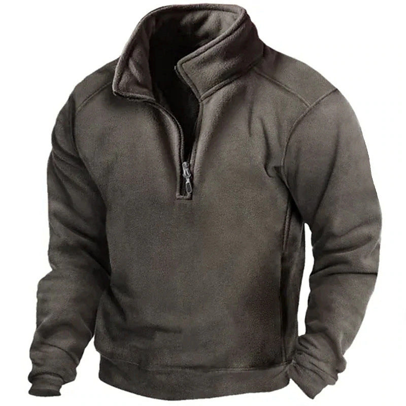 Felpa in pile grigio scuro con zip a metà, design casual e caldo, ideale per l'inverno. Abbigliamento uomo, moda autunno-inverno, comfort.