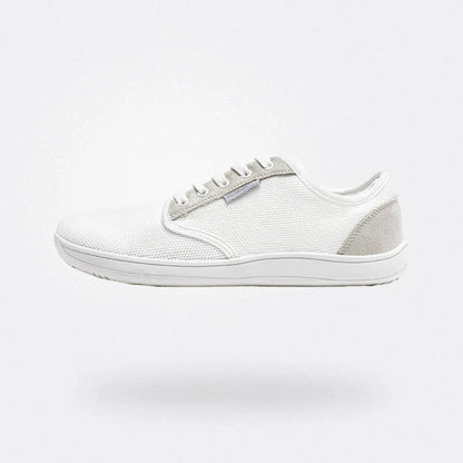 Scarpa da ginnastica bianca minimalista, design moderno, suola in gomma, tessuto traspirante, ideale per sport e tempo libero, comfort e stile.