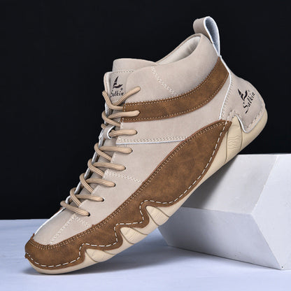 Scarpa da ginnastica alta beige e marrone, design moderno, suola antiscivolo, marchio visibile, ideale per sport e tempo libero.
