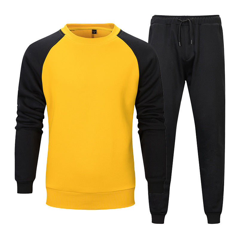 Tuta sportiva uomo gialla e nera, maniche lunghe, pantaloni con coulisse, abbigliamento casual, moda autunno inverno, stile moderno.